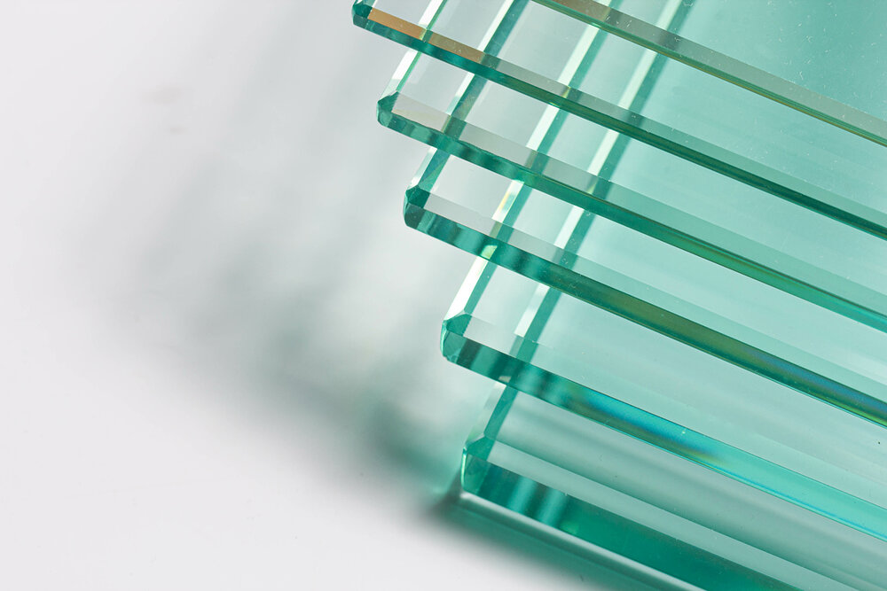Clear glass from factories of various sizes arranged in multiple