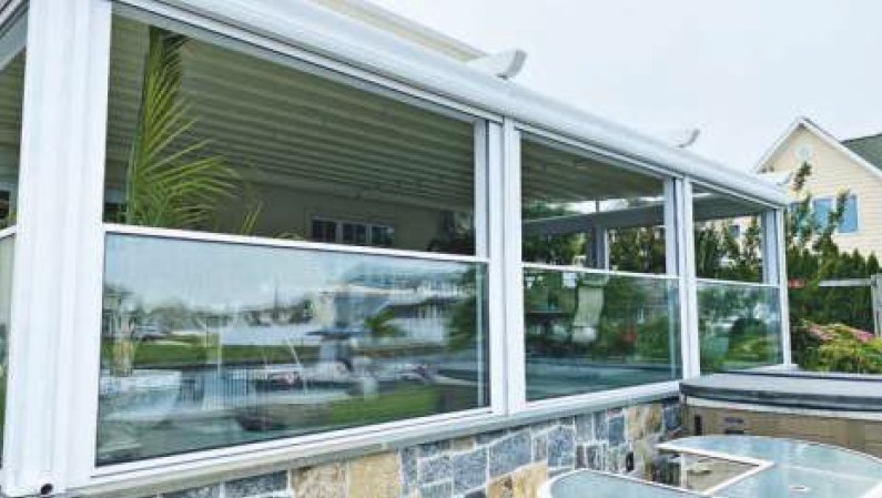 Guillotine glass lowered as a balustrade beside a hot tub