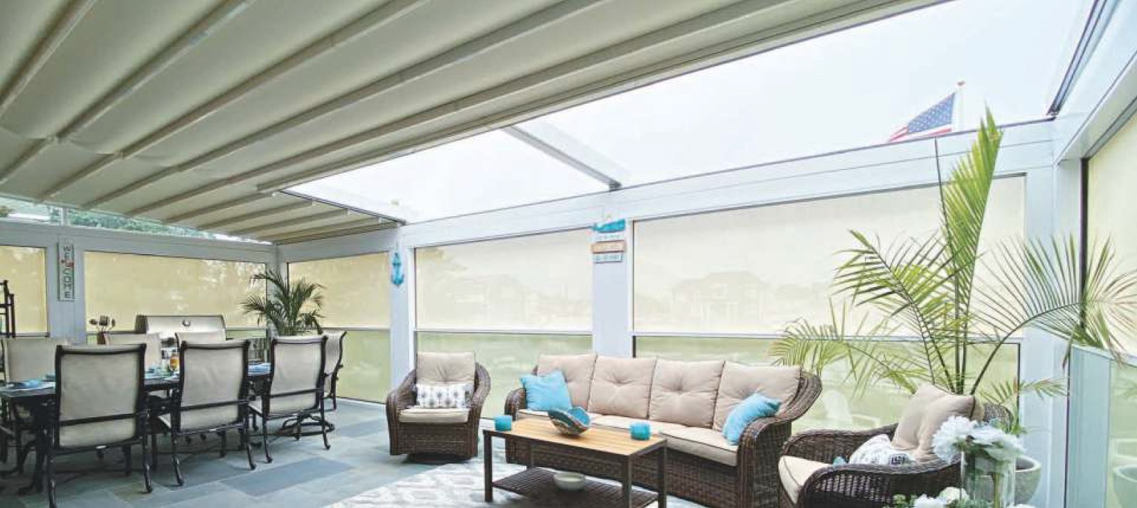 Residential outdoor room with guillotine glass and a retractable roof