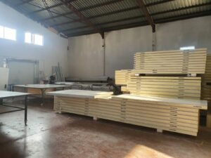 Sandwich panel production and cutting